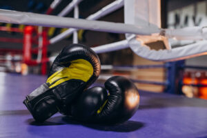 boxing-gloves-lying-empty-ring